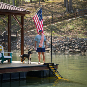 video of WaterDog (a Dog Proofer brand) dock ladder for dogs being enjoyed by a swimming dog and its happy owner!